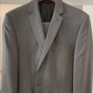 Two piece grey suit. Jacket size 38Long and pants size 32x34 slim. Worn 5 times.